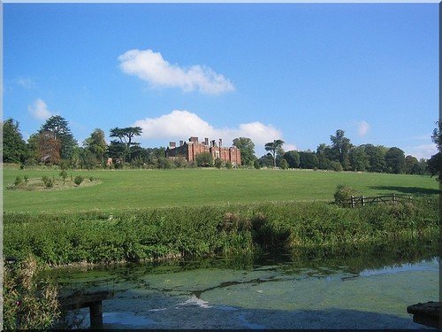A stately home in Buckinghamshire with a river in the foreground
