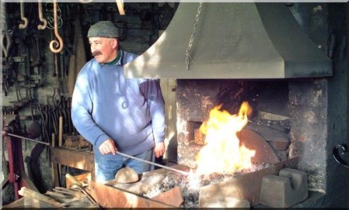 a blacksmith practising traditional skills