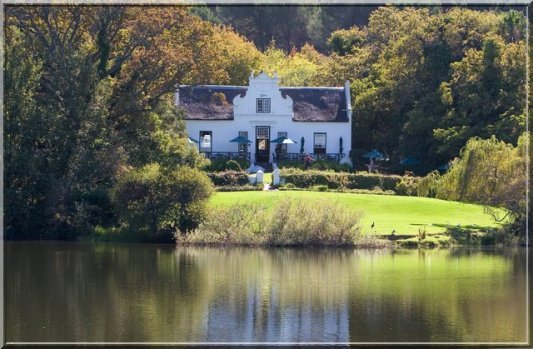 A Cape wine estate with the homestead on a lake