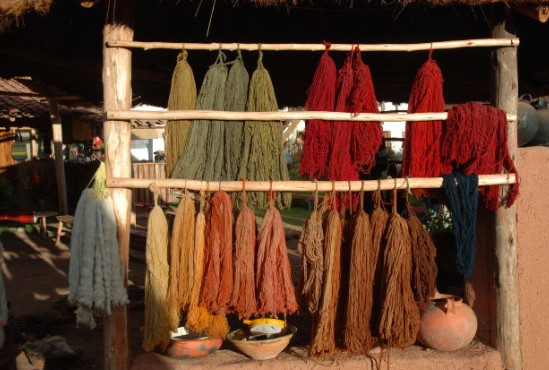naturally dyed alpaca knitting yarn hanging up to dry