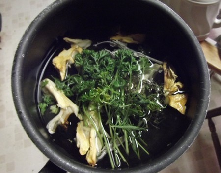a pot brewing a homemade cold and flu home remedy