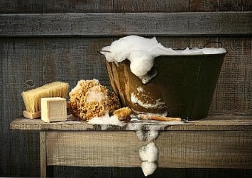 Country washing day - basin, suds, soap and table.