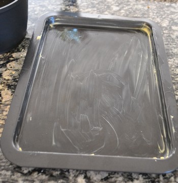 Greased baking tray