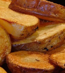 layers of fried potatoes sprinkled with rosemary