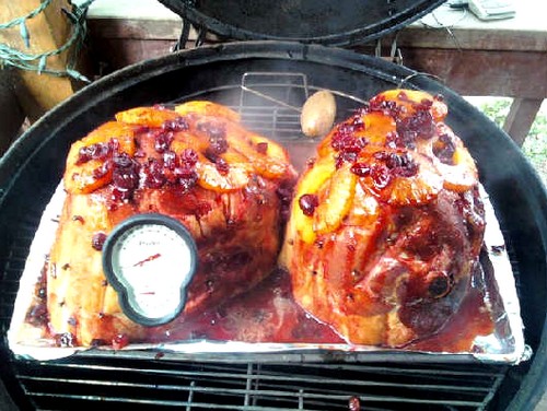 Smoking hams sitting in a metal tray