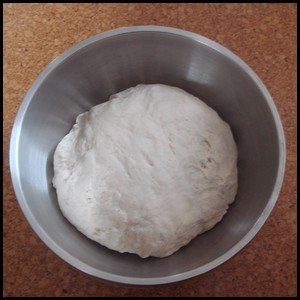 Bread dough in a bowl before rising