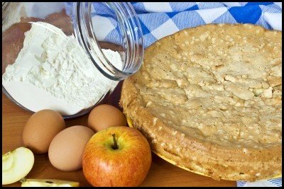 Homemade apple pie with baking ingredients