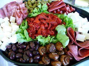an antipasto platter of cold meats, cheese and vegetables
