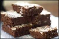 a pile of chocolate hazelnut brownies