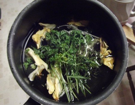 a pot brewing a homemade cold and flu home remedy
