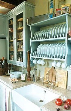 Country kitchen ideas showing a belfast sine and plate holder.