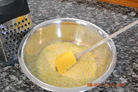 Grating the laundry soap for the homemade detergent.