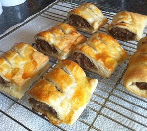 easy homemade sausage rolls cooling on a wire rack