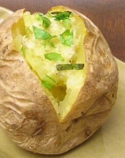 stuffed jacket potatoe split with chopped parsley