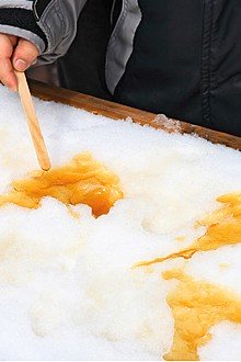 Making maple taffy on the snow, known as Jack Wax.