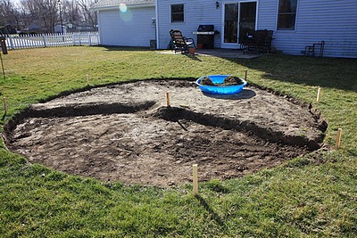 Digging out the soil for the new patio area.