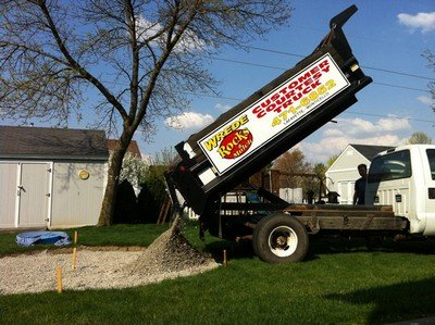 Adding crushed rock to the dug out area for the new patio.