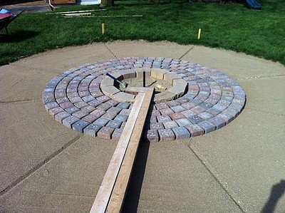 Laying the pavers out from the fire pit.