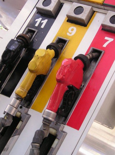 3 pumps for gasoline in black, yellow and red