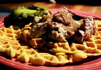 Homemade plain savory waffle with meat and gravy.