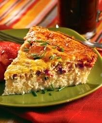 a slice of self-crusting salmon fish pie on a green plate.