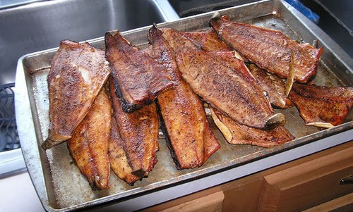 Smoking fish on a tray