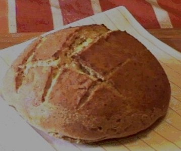 a round loaf of freshly baked sourdough bread