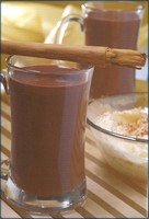 2 mugs of hot chocolate with a cinnamon stick